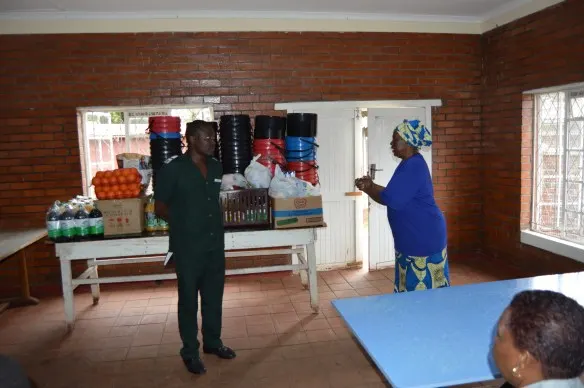 Mercy Servants Coordinator, Mrs. Dorothy Zakeo hands over the donation to Harare Hospital Nurse in Charge of Admissions, Sijabuliso Rutsvara..JPG