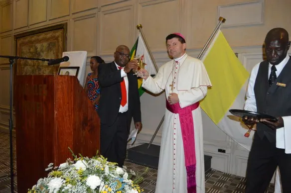 Ambassador Chitsaka Chipaziwa and Archbishop Marek Zalewski propose a toast..JPG