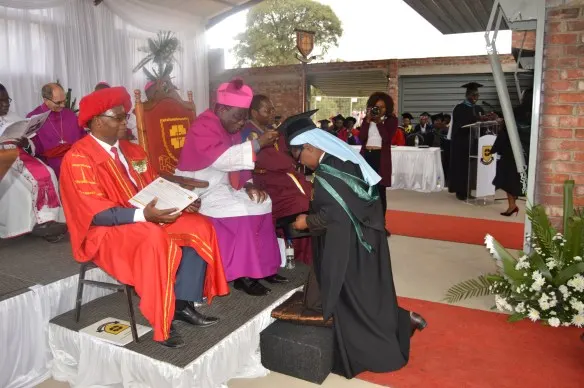Catholic University Chancellor, Archbishop Robert Ndlovu caps Sr. Assumptor during the University's 2018 graduation..JPG