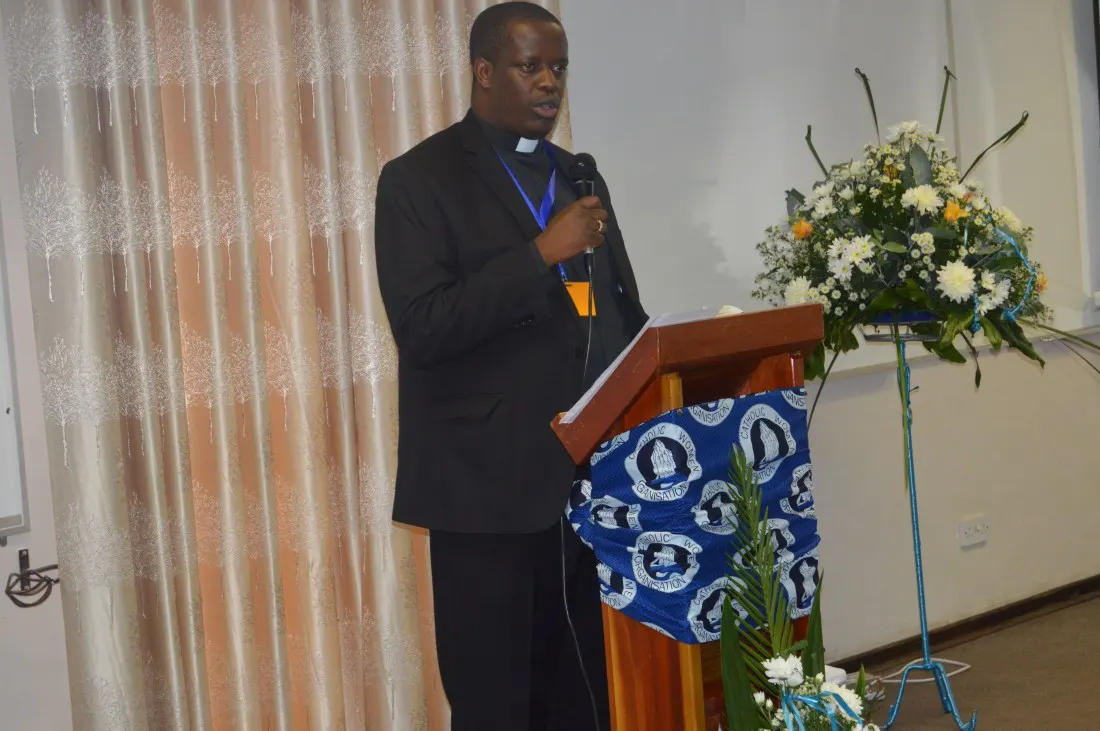 Fr. Jonannes Maseko, the National Youth Coordinator addressing the Plenary Meeting.JPG
