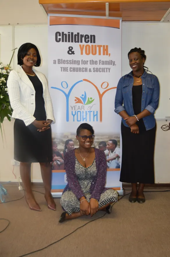 Three youth pause for a picture during the ZCBC 2018 Plenary Meeting.JPG