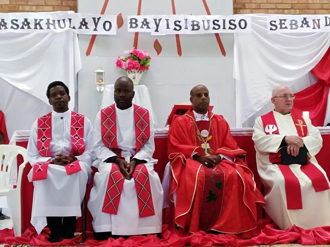 Archbishop Alex flanked by priests durind celebration of the feast of Pentecost at Holy Spirit parish in Bulawayo.