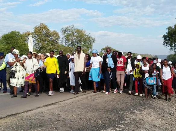 Pilgrims of Hwange Diocese match to St. Mary's Shrine during the Maria Unchena feast day..jpg