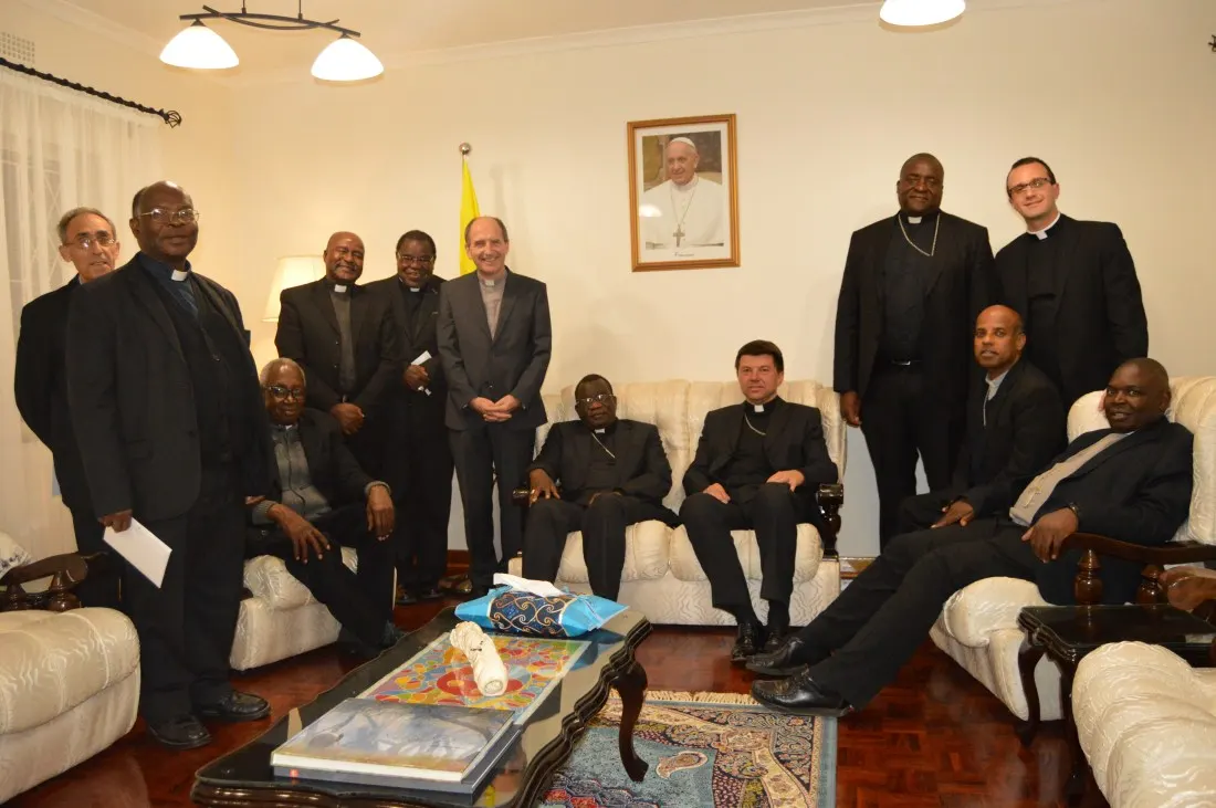 Bishops pose for a photo with Archbishop Mareki Zalewski at a parting dinner..JPG