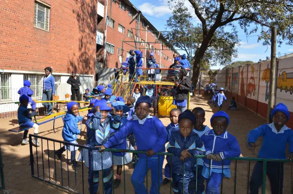 Nenyere day care Centre children play different games outside Nenyere flats which hosts their classrooms.