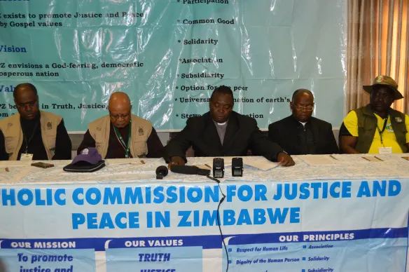 Bisho Rudolf Nyandoro flanked by IMBISA Director, Fr. ClaudiBishop Germano Grachane from the Diocese of Nacala and ZCBC Secretary General, Fr. Fradereck Chiromba and the National Coordinator for CCJP, Mr. paul Muchena..JPG