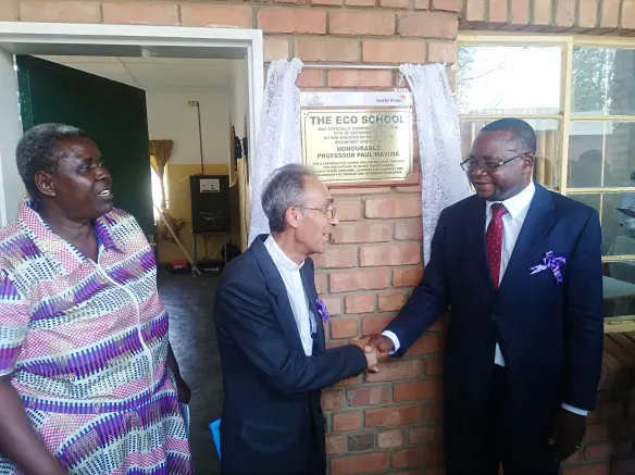 Bishop Albert Serrano and Minister of Primary and Secondary Education, Paul Mavima celebrate the commissioning of the first Eco-School.