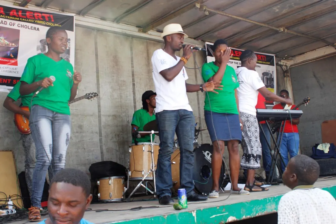 Brian Nyahuma entertains the community in Chitungwiza during the ZCBC cholera awareness raising campaign..jpg
