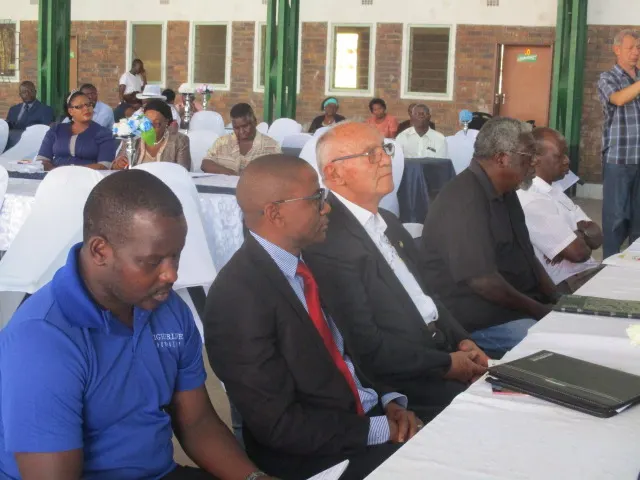 Fr. Bruno sitting at the high table in the company of Fr. Marko Rumhumha and some guests.