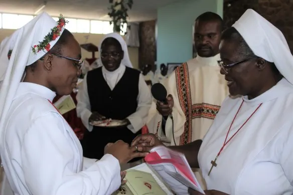 Sr. Cecilia Tembo receives a ring from Sr. Monica Ncube.
