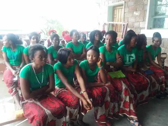 St. Fidelis choir members take a break after some coaching of the local choir.