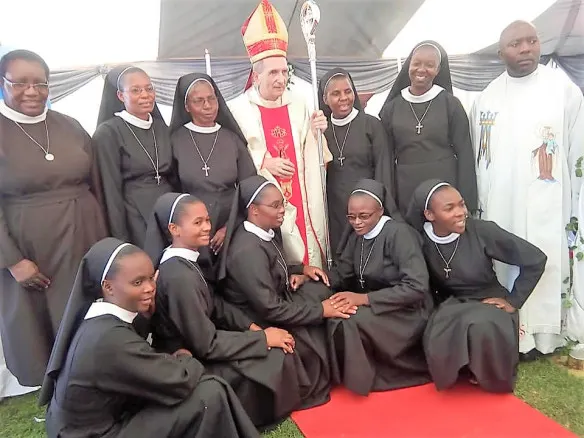 bishop paul horan (centre) flanked by sr. getrude bobo (immediate left), sr. theresa nyadombo (extreme left back row), fr. alexio makokowe and some sisters of the divine