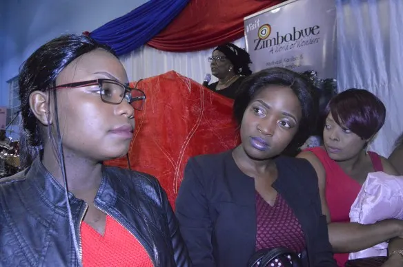 some pilgrims pay attention while minister mupfumira delivers her address.