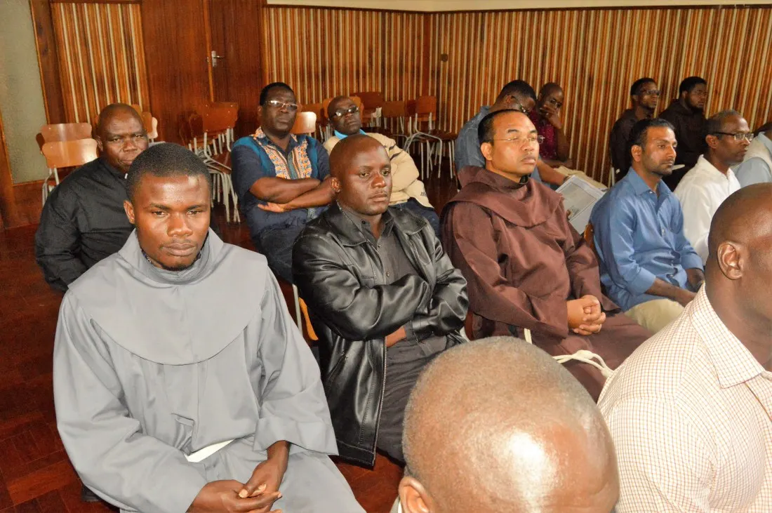 Religious brothers and priests pay attention as Bishop Mupandasekwa shares thoughts about religious life.