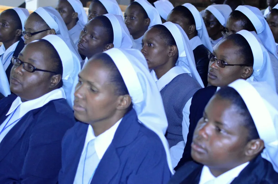 Sisters pay attention during a sermon by Fr. Peter..jpg