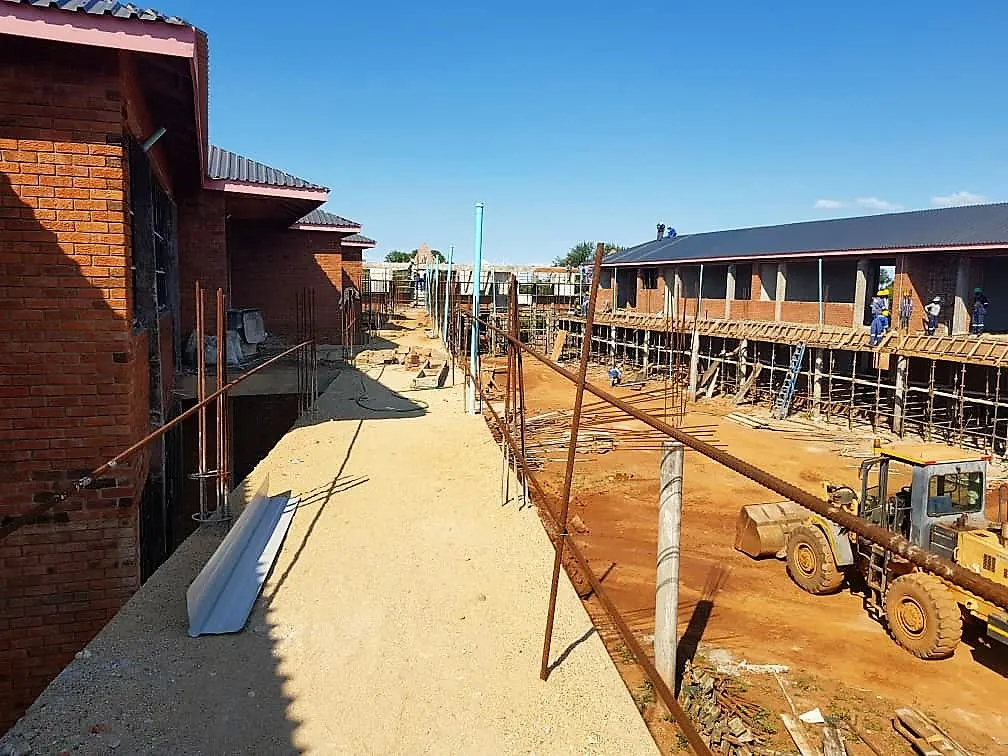 Men at work; contractors put final touches to the huge Sacred Heart College scheduled to open in January 2020.