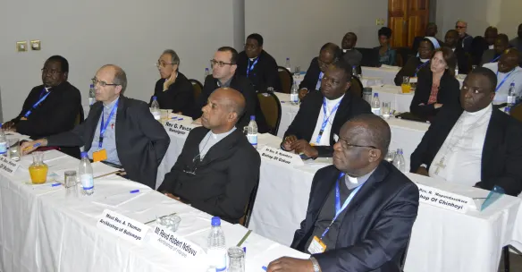 Bishops and delegates pay attention during deliberations at the plenary.