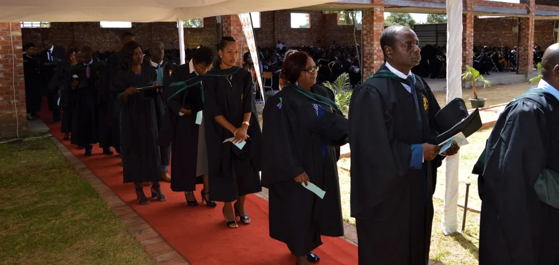 Graduating students line up to be capped by the Chancellor of the Catholic University, Archbishop Robert Ndlovu.