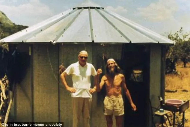John Bradburne with Fr. Dave Outside John Bradburne's hut known as 'Pipers Vale' in Zimbabwe.