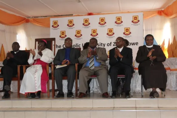 Bishop Michael Bhasera in white Cassock flanked by Fr. Walther Nyatsanza, Professor Ranga Zinyemba, National Education Secretary Sr Theresa Nyadombo and others at the launch of the Catholic University Campus in Masvingo rec