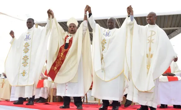 Archbishop Alex presents the newly ordained priests to the congregation.
