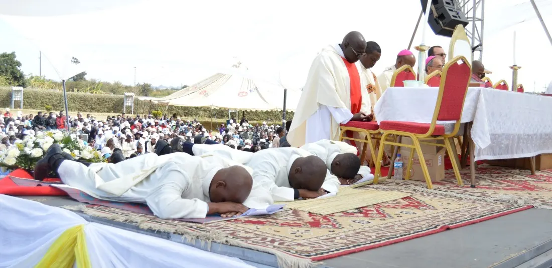 Rev. Prize Madzivanyika, Rev. Brian Kandlela and rev. Vusimuzi Moyo Moyo lie prostrate in humility before their ordination by Archbishop Alex Thomas in Bulawayo.