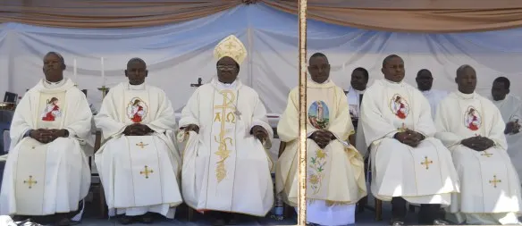 Bishop Bhasera is seen flanked by the new priests after teh Ordination at Mkoba Stadium in Gweru.